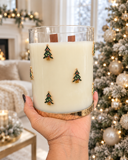 Sweet Christmas jeweled tree candle held in hand in a winter setting