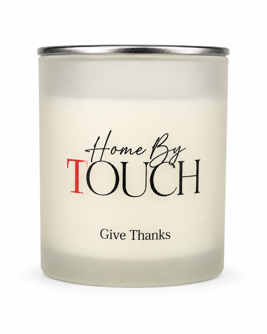 Candle with 'Home By Touch' and 'Give Thanks' text on a white background