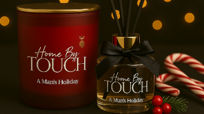 Candle and diffuser set with 'Home By Touch' branding on a dark background with lights.